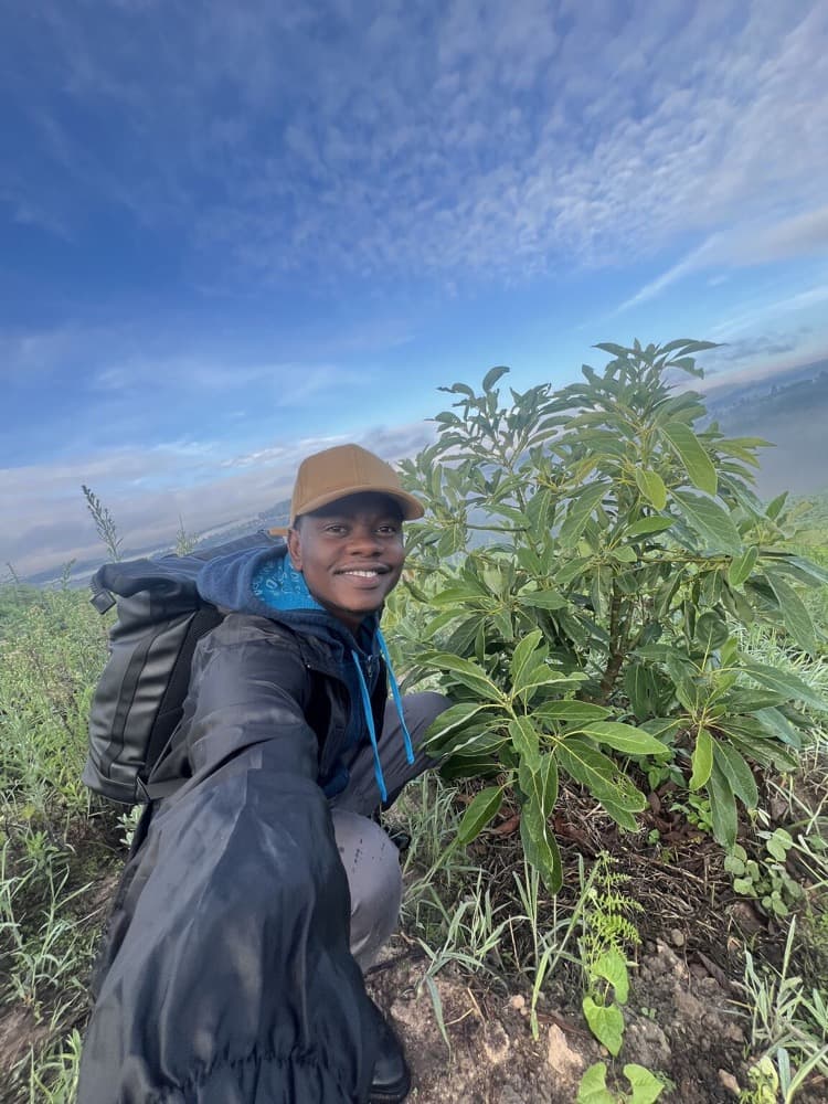 Nicolaus Novatus Mukasa in the avocado orchard at MUSSGO Farms