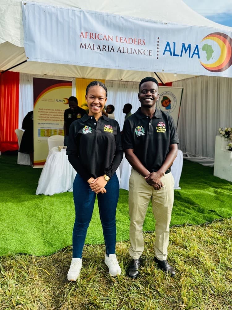 Nicolaus Novatus Mukasa with a Malaria Youth Corps colleague at a national commemoration
