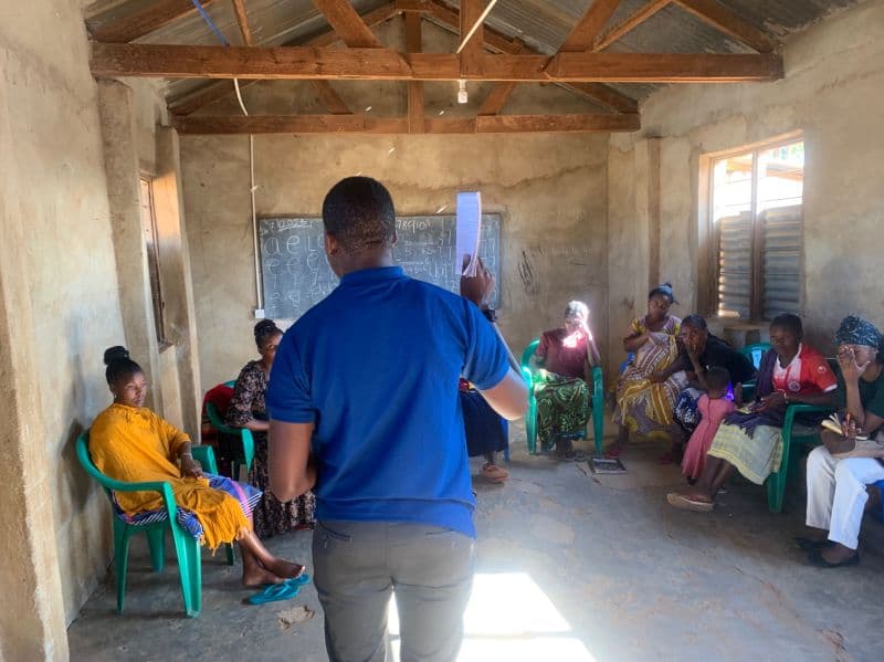 Nicolaus Novatus Mukasa training groups on digital finance tools in Ilambilole