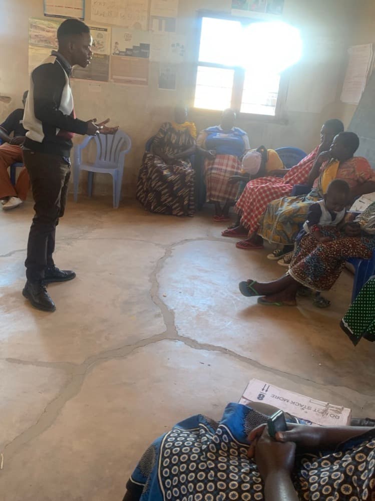 Nicolaus Novatus Mukasa facilitating a VSLA training session in Lugalo, Kilolo District